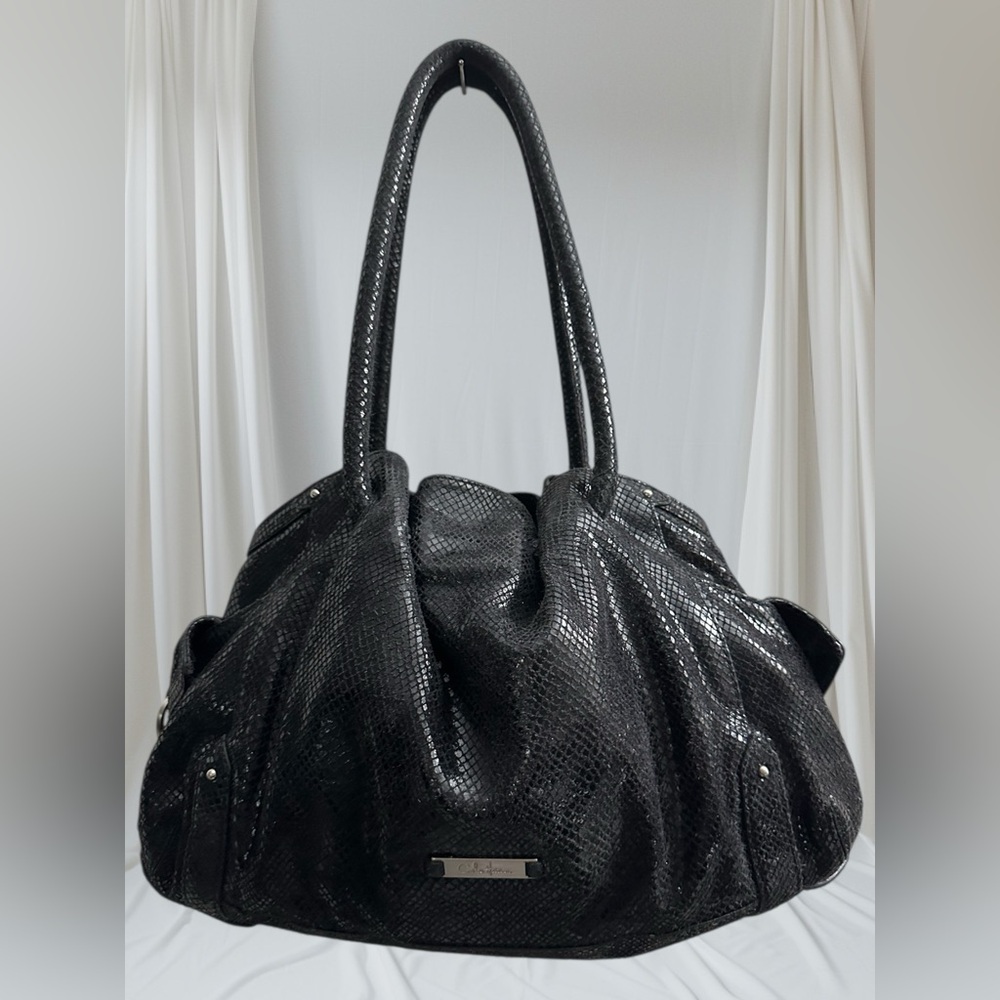Cole Haan Black satchel in metallic snakeskin w/ 2 side buckle pockets